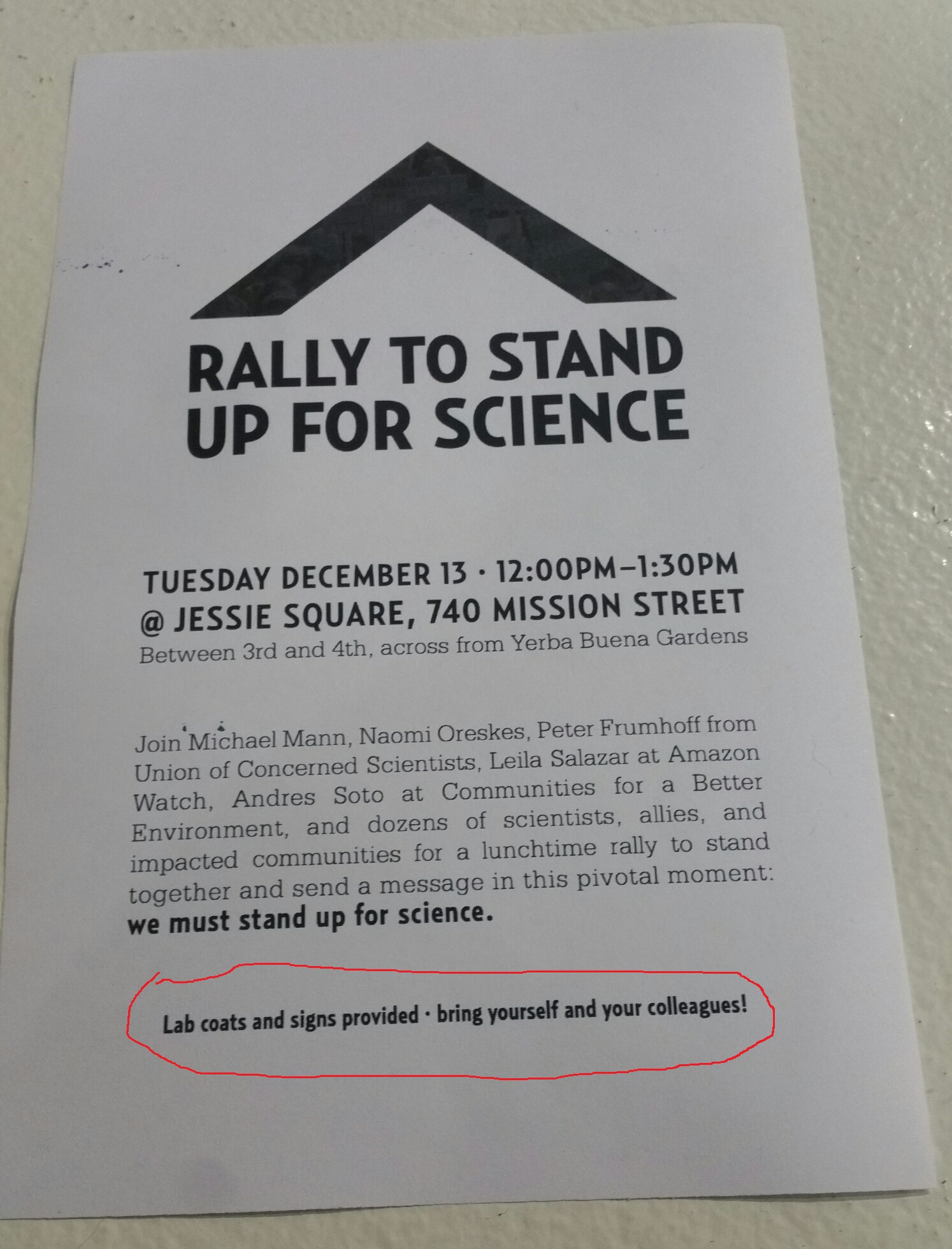 A poster advertising the rally and promising to provide lab coats and signs